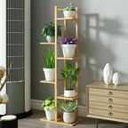 Wooden plant stand with potted plants in a room setting