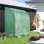 Green arch-shaped greenhouse with plants in a garden setting