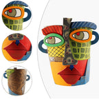 Colorful ceramic face sculpture with close-up details on a white background