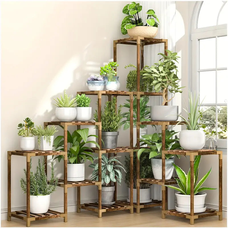 Wooden plant stand with multiple potted plants in a room with large windows.