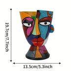 Colorful abstract face-shaped vase with measurements on a white background
