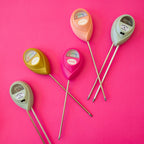 Set of colorful soil moisture meters on a pink background