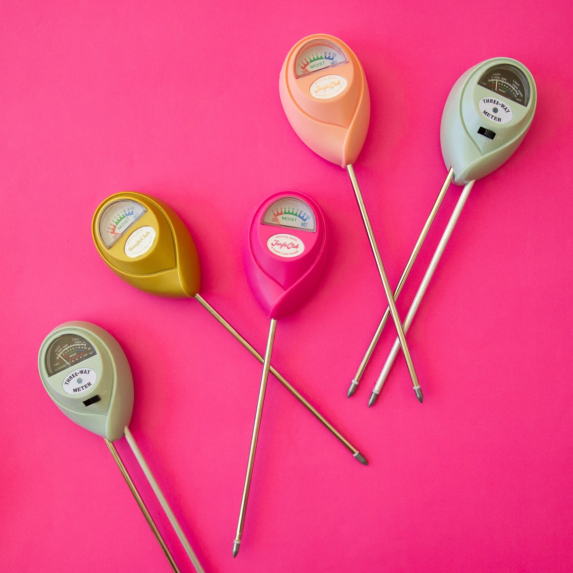 Set of colorful soil testers on a pink background