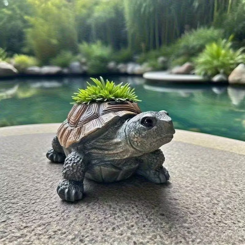 Decorative turtle with grass on its back in a garden setting