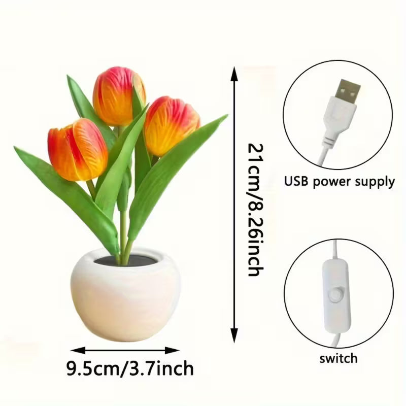 Artificial tulip plant in a pot with USB power supply and switch on a white background